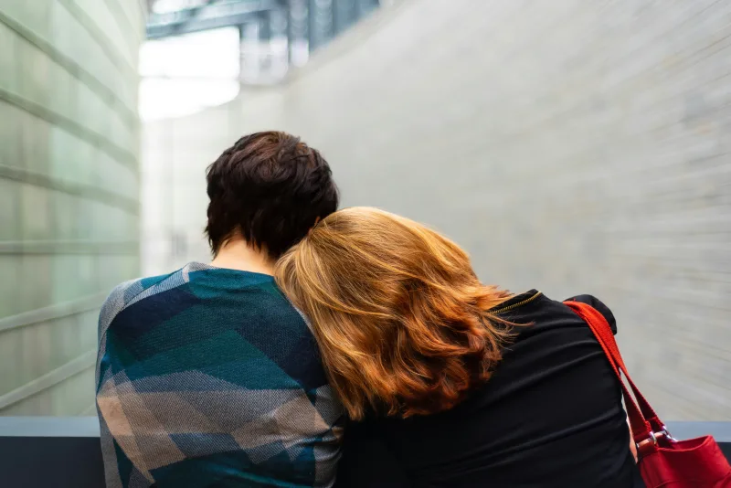 man and woman holding hands